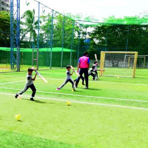 Students at Panbai International School in Santacruz receiving specialized cricket coaching on the turf, practicing and honing their skills for athletic development and teamwork