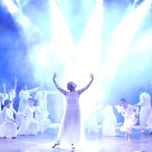 girl in white performing at panbai international school