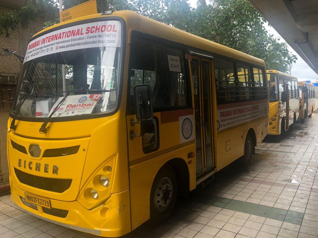 Yellow Panbai International school buses aligned, showcasing the school's dedication to providing safe and reliable school transportation for students