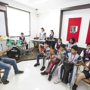 Students participating in a music session at Panbai International School